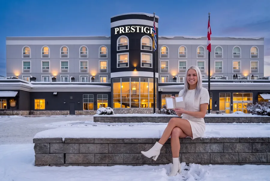 Woman on the planter outside the Prestige hotel